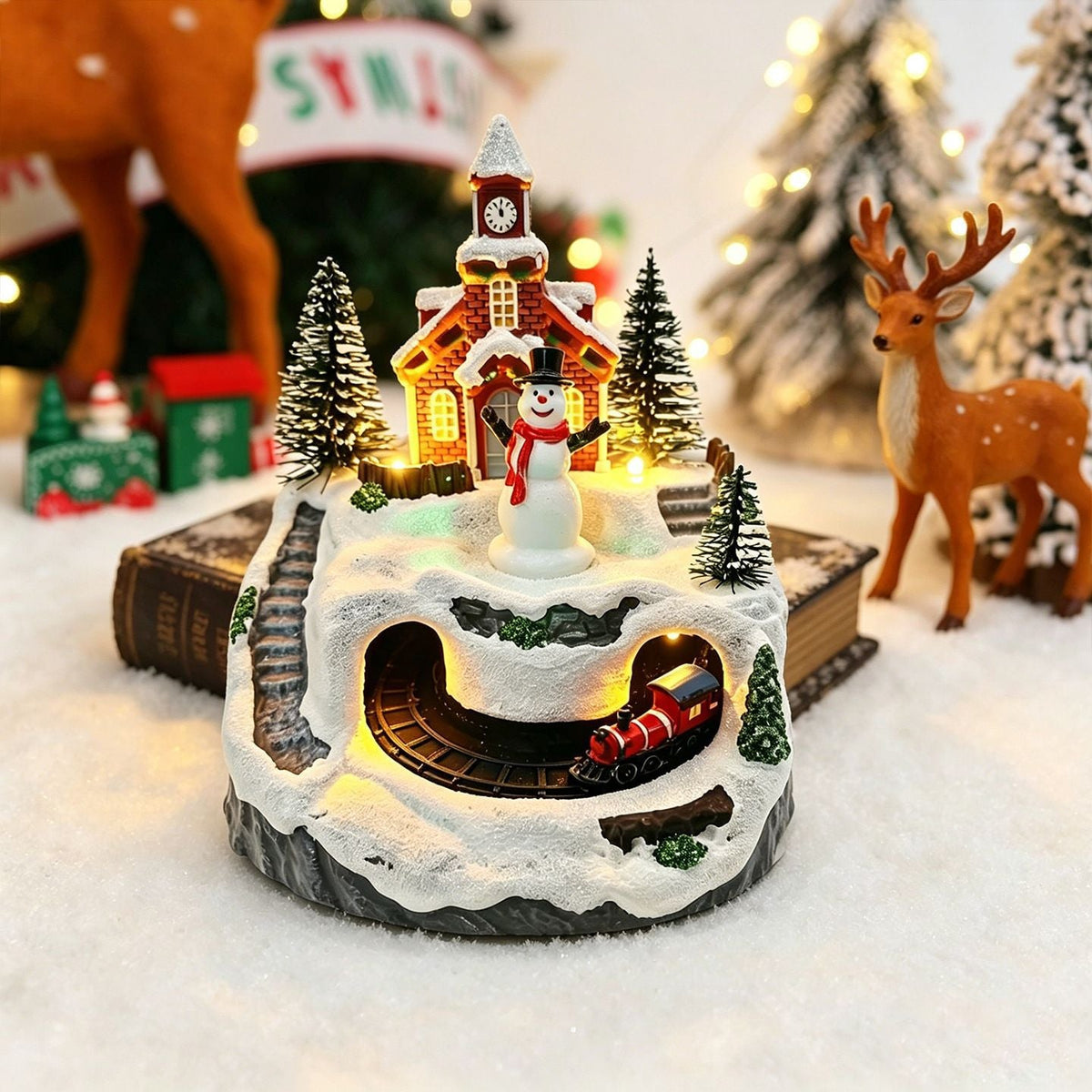 Julelandsby med lys og bevægelige figurer